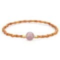Traditional bamboo-style olive pit bracelet with central pink strawberry crystal. - Strawberry Quartz