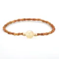 Chinese style bamboo-shaped olive pit bracelet with a golden crystal bead - Citrine