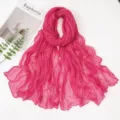 Detailed view of the vibrant pink crinkled voile scarf, showcasing lightweight texture and elegant drape. - Rose Red