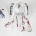 Detailed view of white floral embroidered cotton linen scarf, elegant bohemian style shawl. - White
