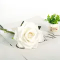 White artificial rose flower with green stem, perfect for wedding home party decor. - White