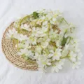 Realistic artificial white jasmine vine garland for wedding decor on a woven mat - White