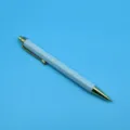 Elegant hexagonal retractable ballpoint pen in light blue with gold metal accents - 1.0mm Bullet Tip / Cyan