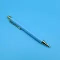 Light blue retractable ballpoint pen with elegant gold-colored metal accents - 1.0mm Bullet Tip / Blue