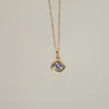 Close-up detail of 18K gold plated necklace featuring a square lavender zircon pendant - June