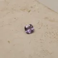 Detailed close-up of a brilliant cushion-cut purple zircon gemstone showing fine facets - February-Pendant Only (Without Chain)