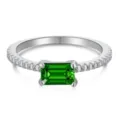 Macro detail of a sterling silver emerald-cut green gemstone ring with side diamonds - Size 7 / Emerald Cut Eternity Style / Emerald