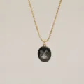 Detailed view of elegant gold bead chain necklace with hand-painted cat portrait pendant - Black Cat