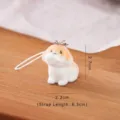 Cute flocked puppy charm figurine for keychains or desktop decor - Orange and White Puppy