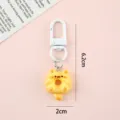 Cute yellow Pusheen-style cat donut keychain with white metal clasp and 6.2cm height - Cat Style C (Keychain)