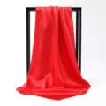 Detailed view of a vibrant red satin square scarf with a smooth and lustrous texture. - 90*90cm / Red
