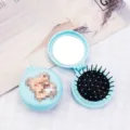 Compact light blue foldable air cushion hairbrush featuring a cute bear and built-in mirror - Blue Box - Milk Tea Bear / Cartoon Folding Air Cushion Combs