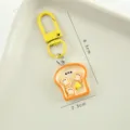 Creative resin toast keychain with miniature butter detail, yellow metal clasp, 6.3cm length - 吐司早餐盘款 / 全长6.3cm挂件宽度2.3cm