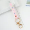 Pink silicone wristband keychain with SUMMER lettering and a gold lobster clasp - Solid Color / Light Pink