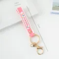 Pink silicone wrist strap keychain with SUMMER print, gold ring and lobster clasp, 17cm long. - Solid Color / Deep Pink
