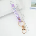 Purple PVC silicone wrist strap keychain with gold metal hardware and summer text - Solid Color / Purple