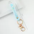 Light blue PVC silicone wrist strap keychain featuring Summer text and golden ring - Solid Color / Light Blue