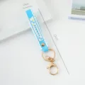 Sky blue PVC scalloped wristband keychain with gold metal clasp and 'SUMMER' print detail - Solid Color / Lake Blue