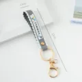 Elegant gray PVC wrist strap keychain with scalloped edges and gold hardware, 17cm long - Solid Color / Light Gray