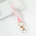 Pink PVC soft rubber wrist strap keychain with gold clasp and Summer logo - Translucent Style / Light Pink