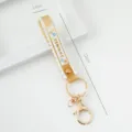 Yellow PVC soft glue wristband keychain featuring SUMMER text and wavy edge 17cm - Translucent Style / Tan