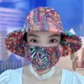 Close-up of a floral pattern sun hat with an integrated face mask for UV protection - Ethnic Floral Style / Red