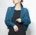 Detailed view of elegant teal honeycomb knit shrug shawl on model wearing a black dress - Tops / 60-80cm / Blue