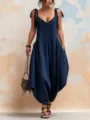 Detailed macro view of navy blue loose-fit wide-leg jumpsuit featuring V-neck and straps - S / Dresses / Navy Blue