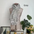 Classic gray and white houndstooth cashmere-like scarf shown on a wire mannequin - Black & Grey Houndstooth / 180*70