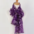 Detailed macro shot of the elegant purple floral print scarf with ruffled wood ear edges. - Deep purple