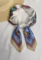 Detailed close-up of 70cm square silk scarf featuring an elegant vintage horse carriage print - Carriage Light Blue
