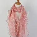 Close-up detail of the pink floral embroidery and ruffled lettuce edges on the scarf - Coral Pink