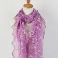 Close-up of purple gauze scarf featuring floral prints and delicate lettuce edge details. - Lavender