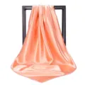 Detailed view of peach satin square scarf showing smooth texture and elegant sheen - 90*90cm / Champagne