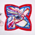 Detailed view of a square silk scarf with red border and vibrant striped pattern - Red Border Multi Arc Stripe (Style 11)