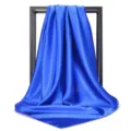 Macro view of a vibrant royal blue satin square scarf showing its smooth silky texture - 90*90cm / Sapphire Blue