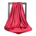 Detailed close-up view of a solid red satin square scarf with an elegant glossy silk finish - 90*90cm / Burgundy