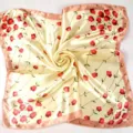 Detail of a cream silk square scarf with red flowers and pink stitched edges. - Beige Pink Border Red Ditsy (Style 17)