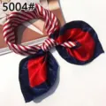 Detail view of a red and navy blue striped professional silk square scarf tied as a bow - Red Blue White Bow Knot (Style 20)