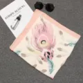 Elegant peach silk-like square scarf with an artistic peacock feather print design - 70*70cm / Ivory Pink