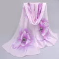 Detail shot of long pink chiffon scarf with purple floral print for summer protection. - Pink Purple