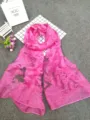 Detailed view of pink sheer scarf with elegant cut-flower patterns and textures - Rose Red