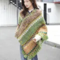 Ethnic style knitted poncho with zigzag patterns and fringe tassels for women's winter fashion. - Green