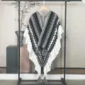 Ethnic style knitted poncho with grey zig-zag patterns and elegant tassel details. - Tops / Gray