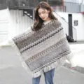 Ethnic style knitted pullover poncho with decorative tassels and geometric patterns. - Gray