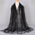 Elegant black nylon lace shawl featuring intricate hollow patterns and stylish fringe tassels - 170x65cm / Black
