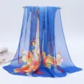 Elegant blue chiffon long silk scarf featuring vibrant orange floral pattern for women - 155x50cm / Begonia Sky Blue