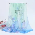 Elegant chiffon long scarf featuring a bird and floral print in blue and green gradient - 155x50cm / Magpie - Light Blue