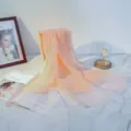Elegant apricot silk wool scarf featuring shimmering gold foil edges, lightweight and versatile - Ivory White