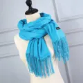 Bright blue imitation cashmere scarf with tassels shown on a mannequin torso - Light Blue